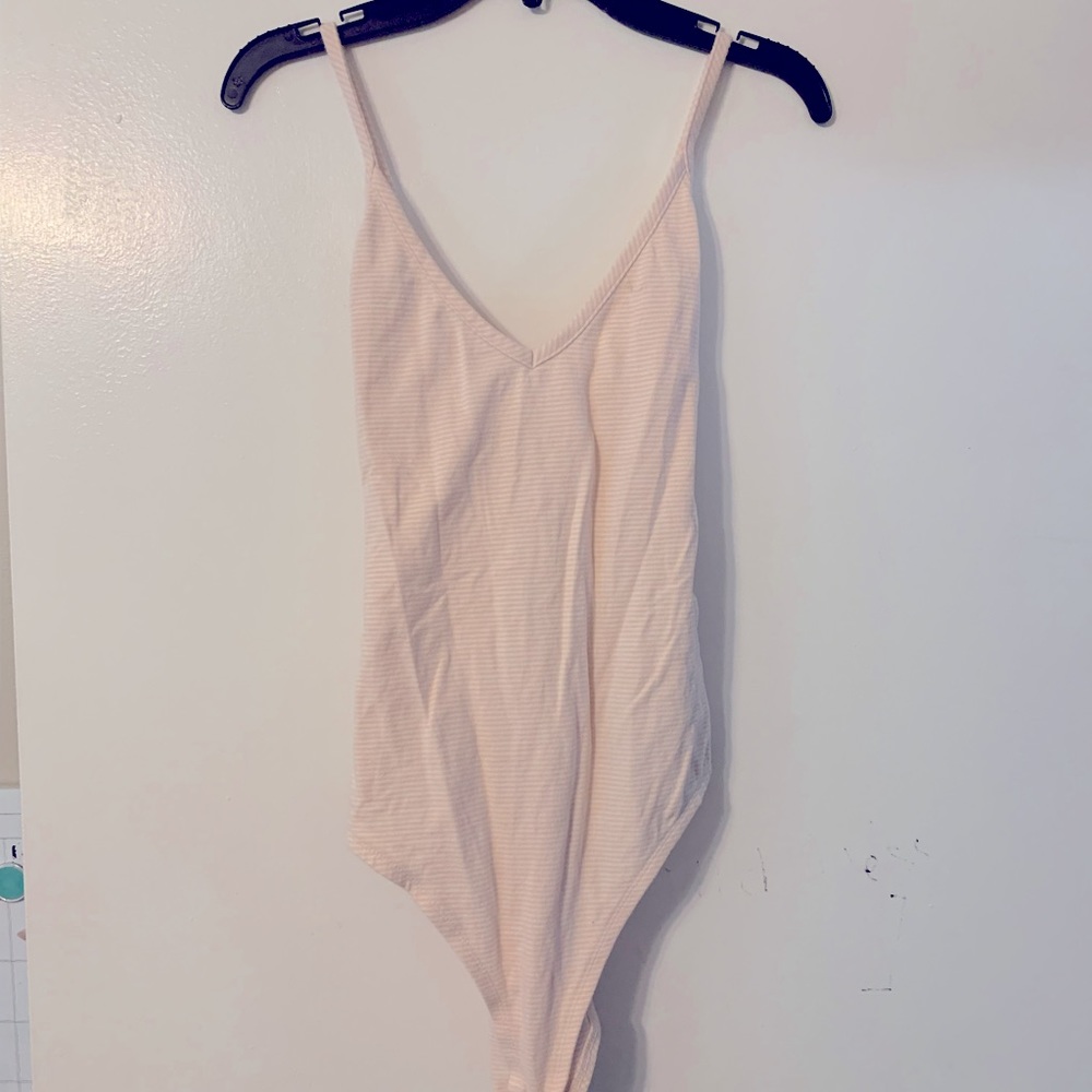 Pink strip body suit with a crisscross back!